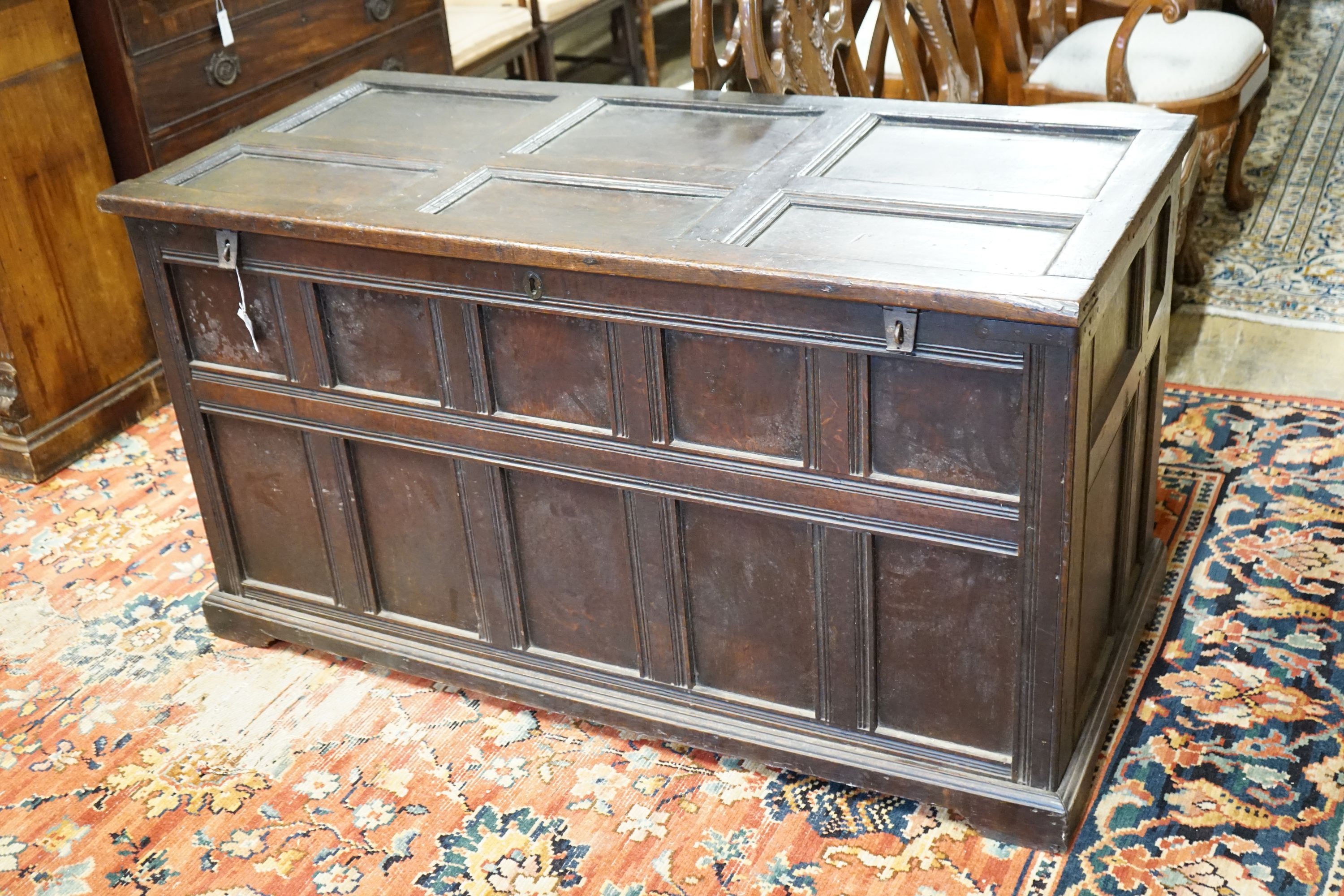 An 18th century panelled oak coffer, length 147cm, depth 67cm, height 80cm